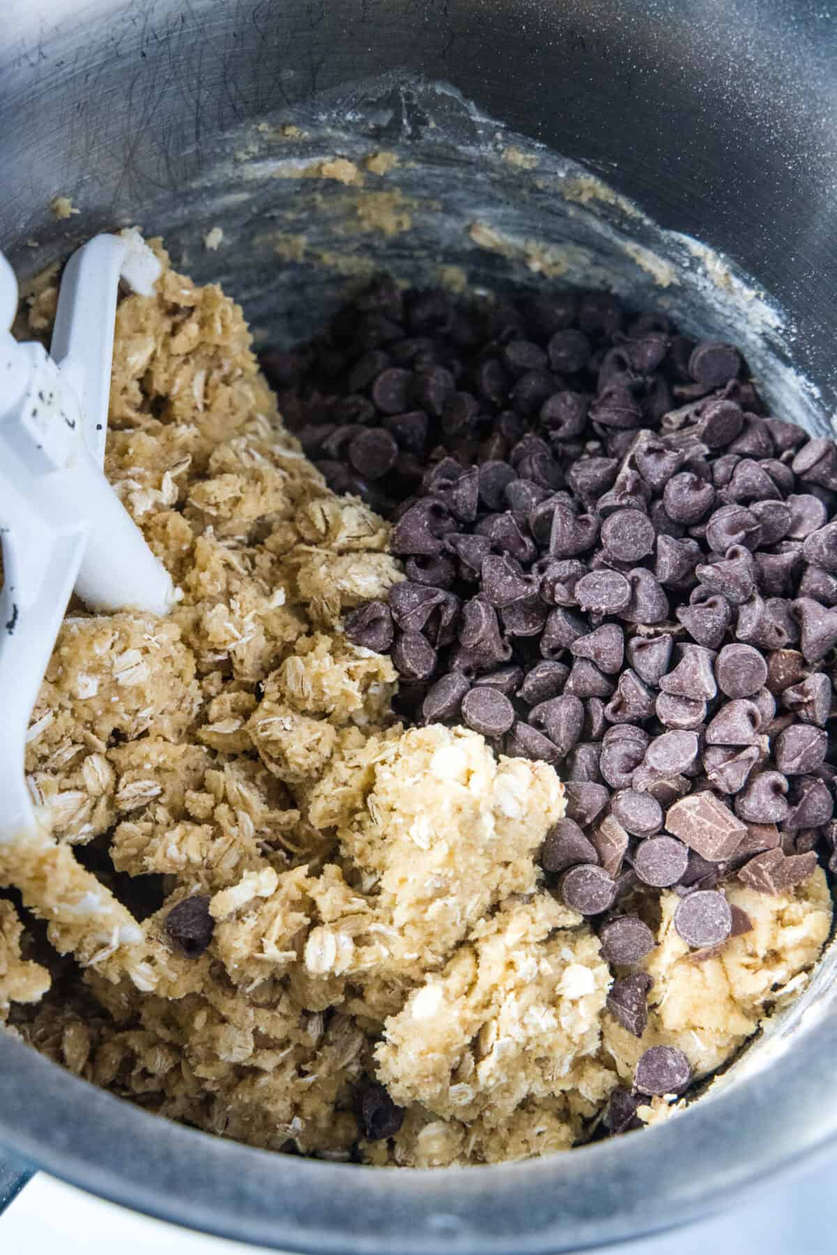 adding chocolate to cookie dough