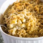 close up caramelized onion mac and cheese in baking dish