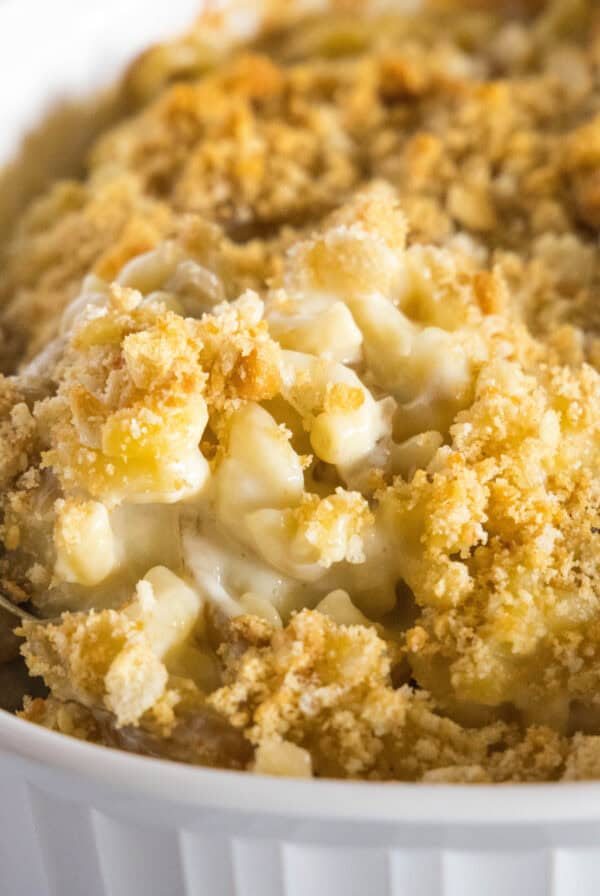 close up caramelized onion mac and cheese in baking dish