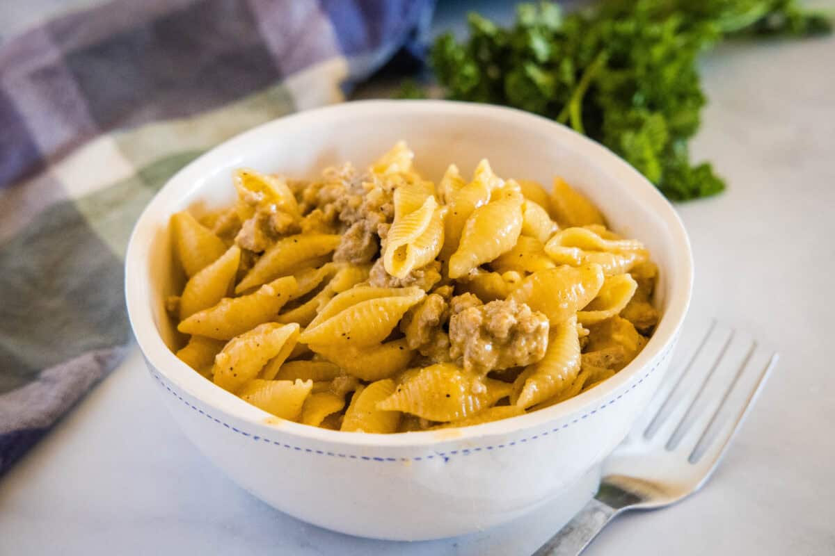 This Ground Turkey Pasta is a simple, comforting one-pan dinner that’s ready in about 30 minutes. Lean ground turkey, pasta, and just a few spices come together to make a hearty, flavorful meal the whole family will love! Save this for your next quick dinner idea.
