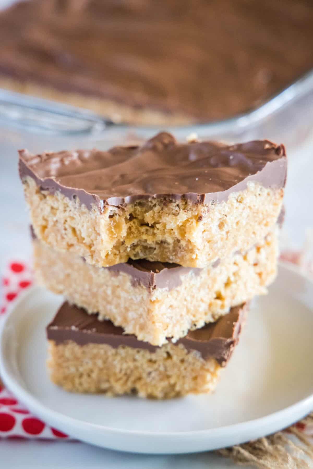 stacked Scotcheroos on a white plate