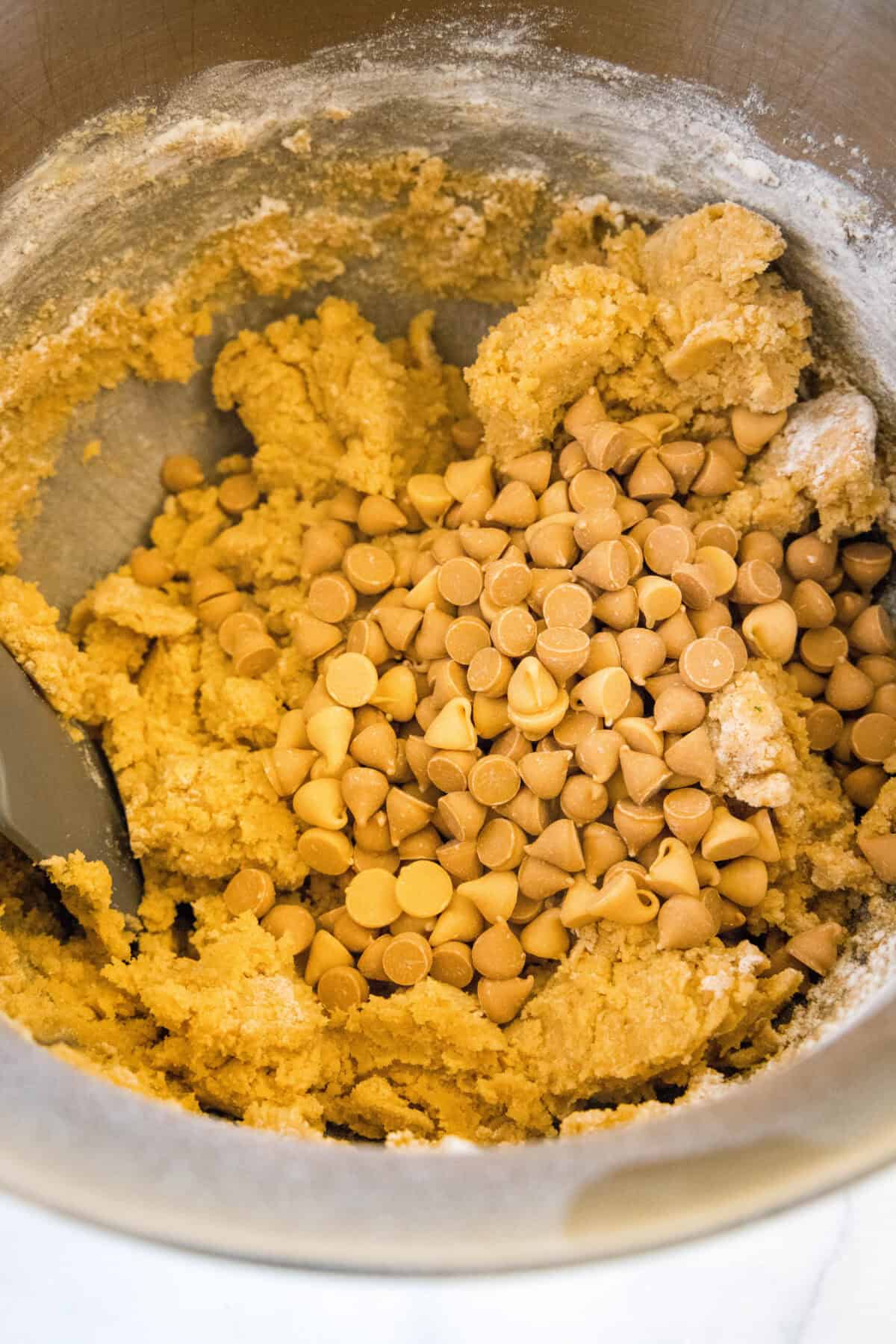 adding butterscotch chips to cookie dough