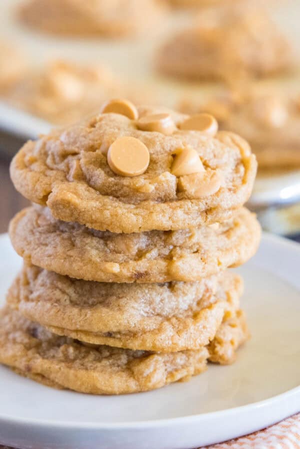 close up stacked butterscotch pudding cookies on a white plate