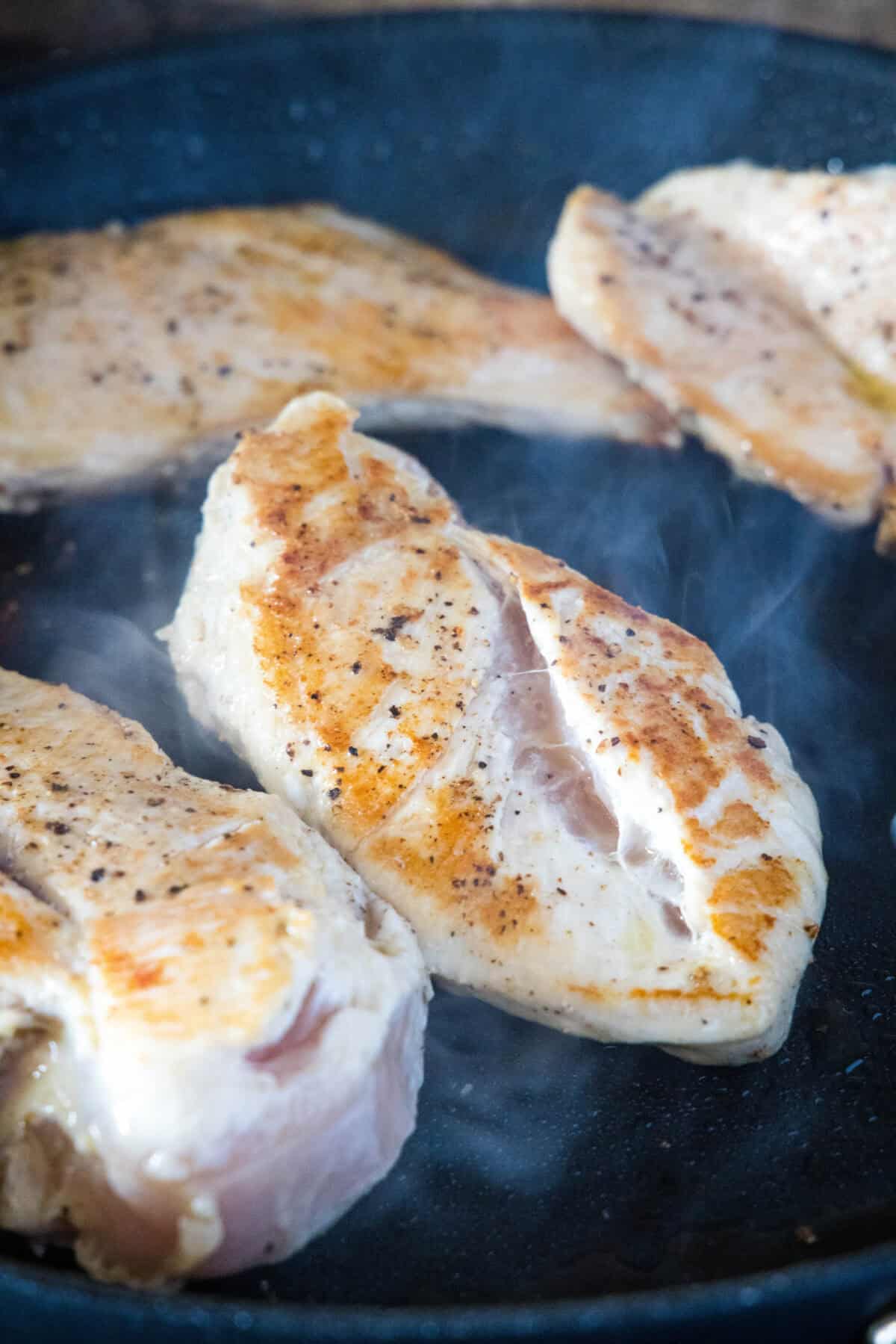 browning chicken in a skillet