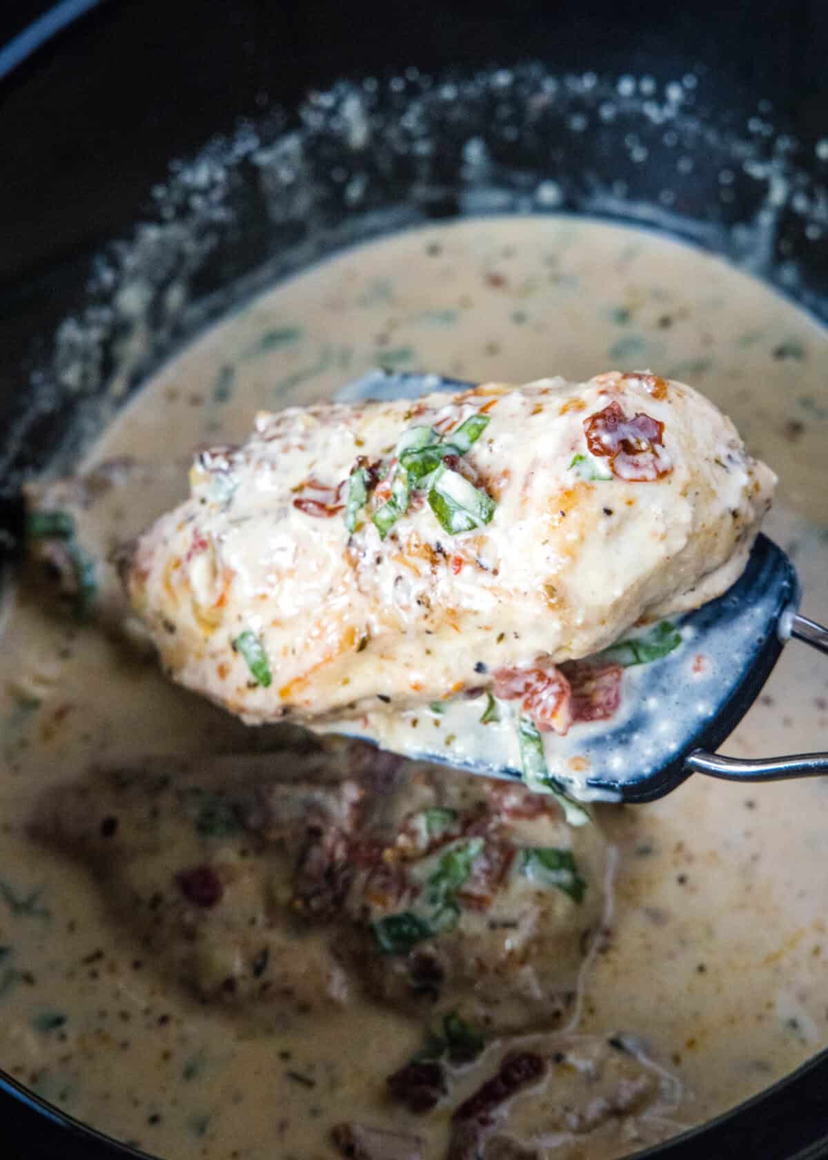 lifting marry me chicken out of the slow cooker