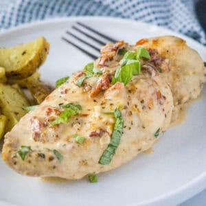close up marry me chicken on a white plate