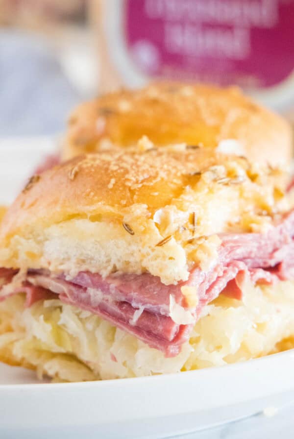 cropped square close up reuben sliders on a plate