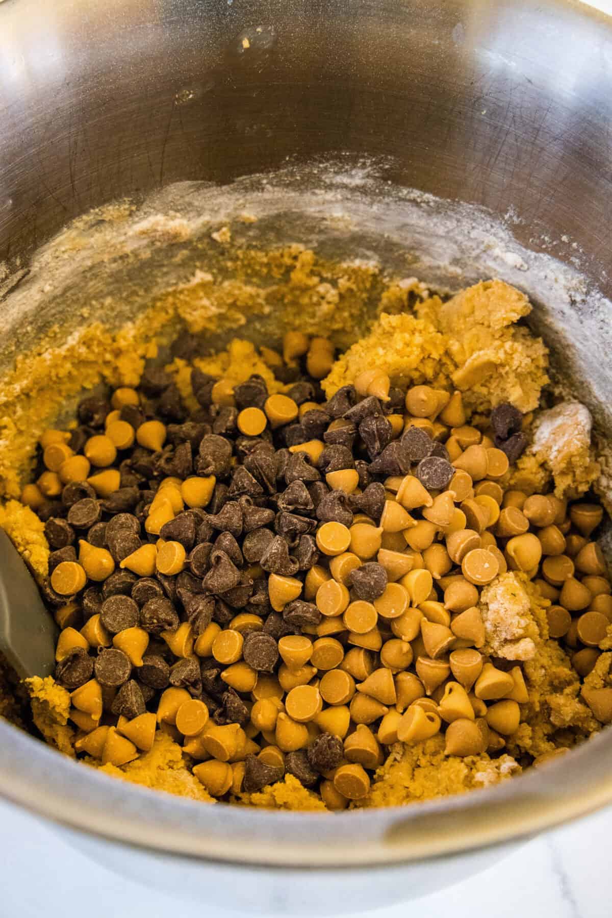 adding chips to cookie dough