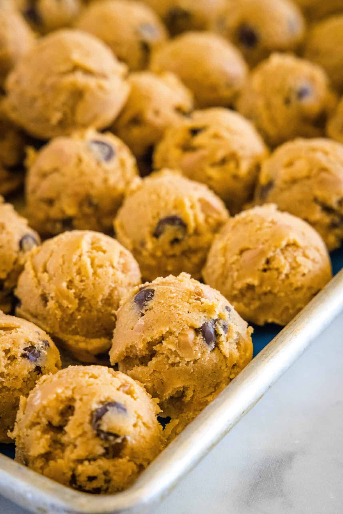 balls of cookie dough on baking sheet