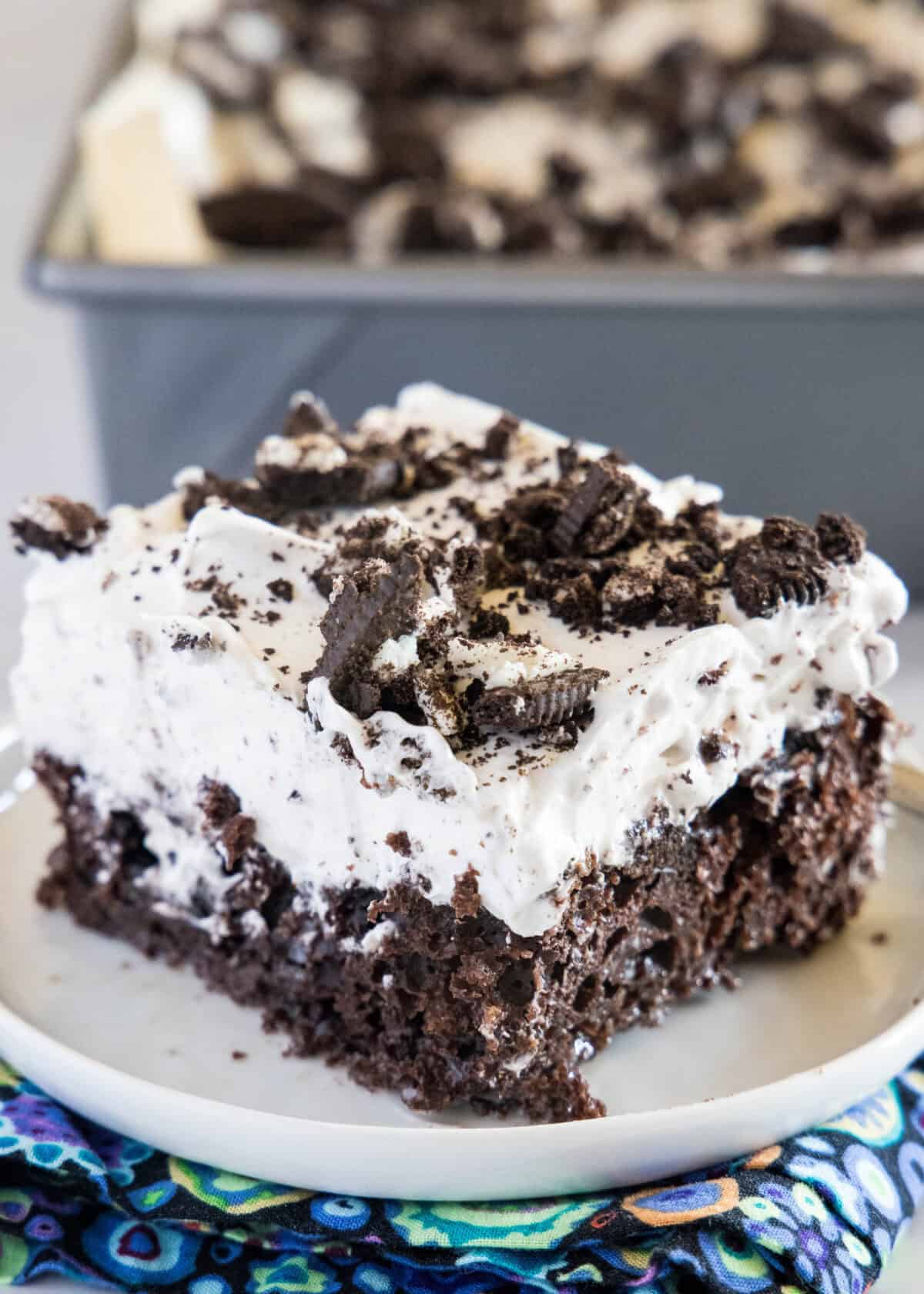 slice of oreo poke cake on a plate