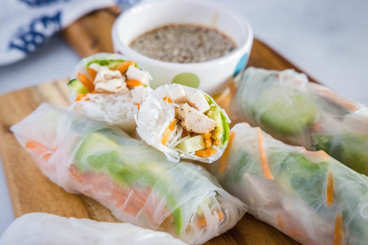 Chicken Spring Rolls – Fresh rice paper rolls packed with chicken, crisp vegetables, avocado, and rice noodles. Light, colorful, and served with a quick teriyaki dipping sauce, they’re perfect for a refreshing lunch, appetizer, or easy dinner.