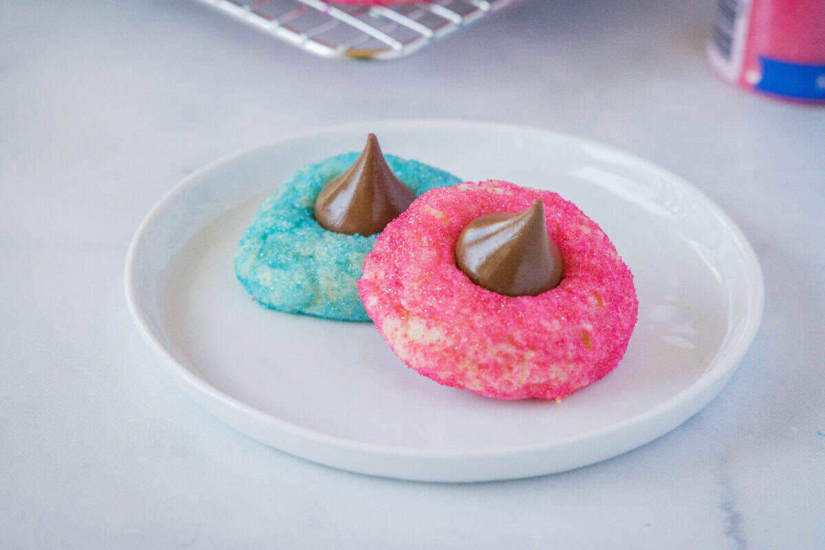 Easter Blossom Cookies are soft, chewy sugar cookies rolled in colored sugar and topped with a Hershey Kiss. A festive and easy treat perfect for spring and Easter.