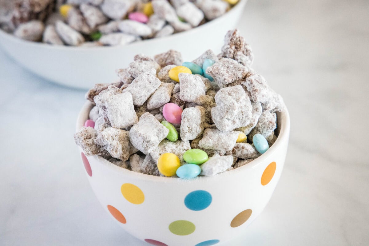 Easter Muddy Buddies - classic muddy buddies taken up a level with more peanut butter and chocolate! Plus decorated for Easter!