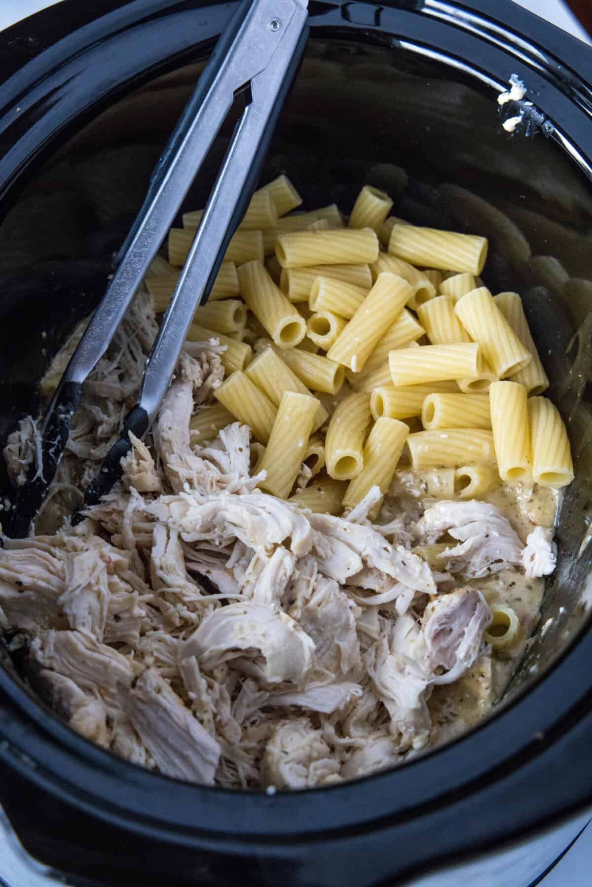 adding chicken and pasta back to the crockpot