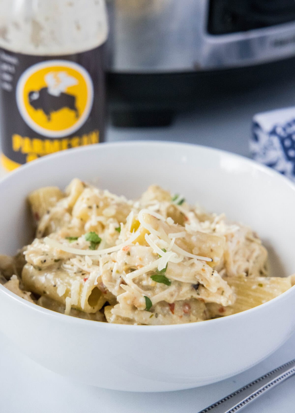 slow cooker garlic parmesan chicken pasta in a bowl