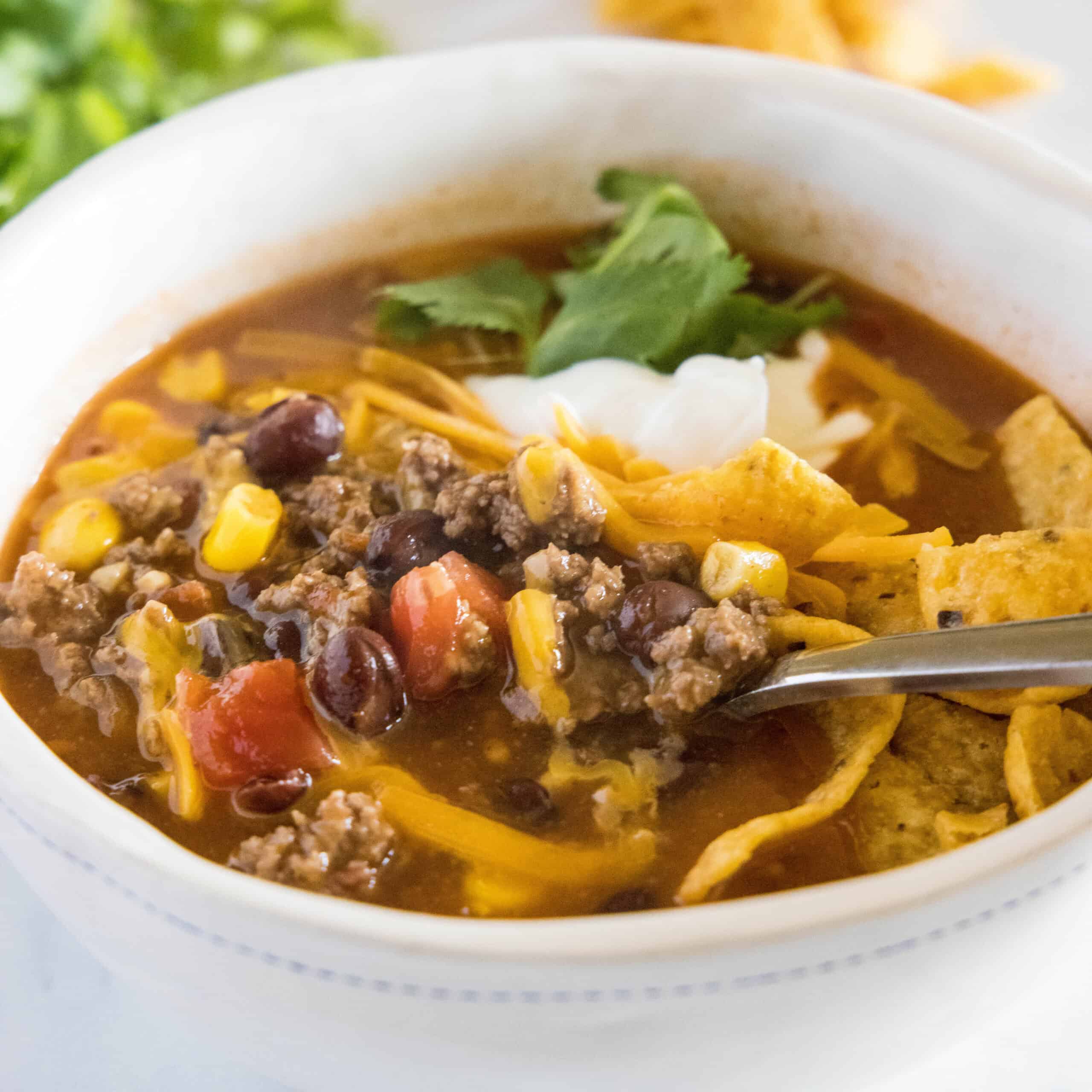 close up taco soup in a bowl with a spoon