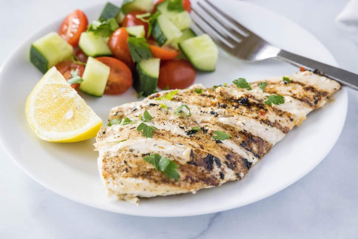 Yogurt Marinated Chicken – Tender grilled chicken coated in a lemony Greek yogurt marinade with garlic and herbs.
