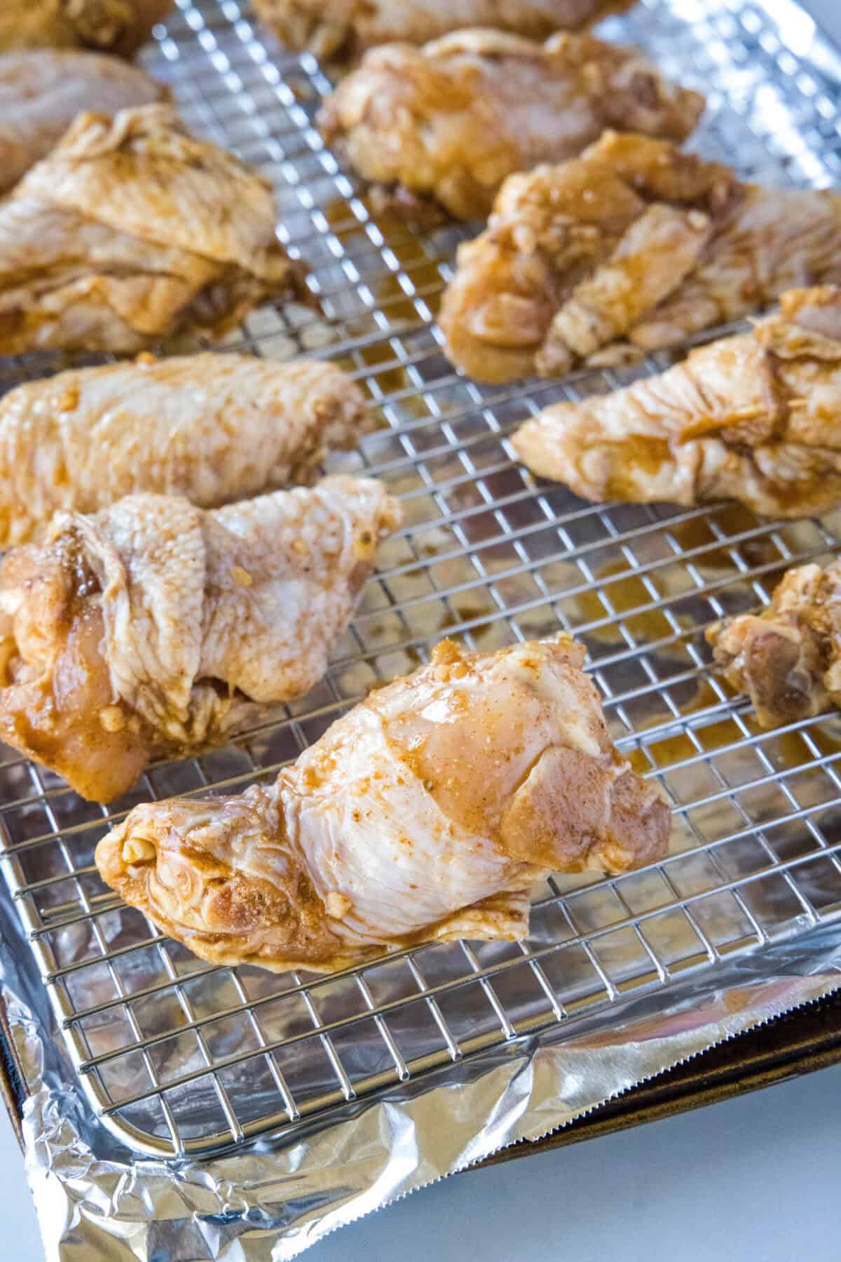 marinated chicken wings on baking tray