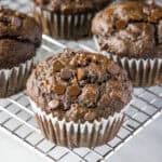 close up choolate banana muffin on cooling rack
