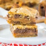 close up stacked biscoff cookie bars on a plate