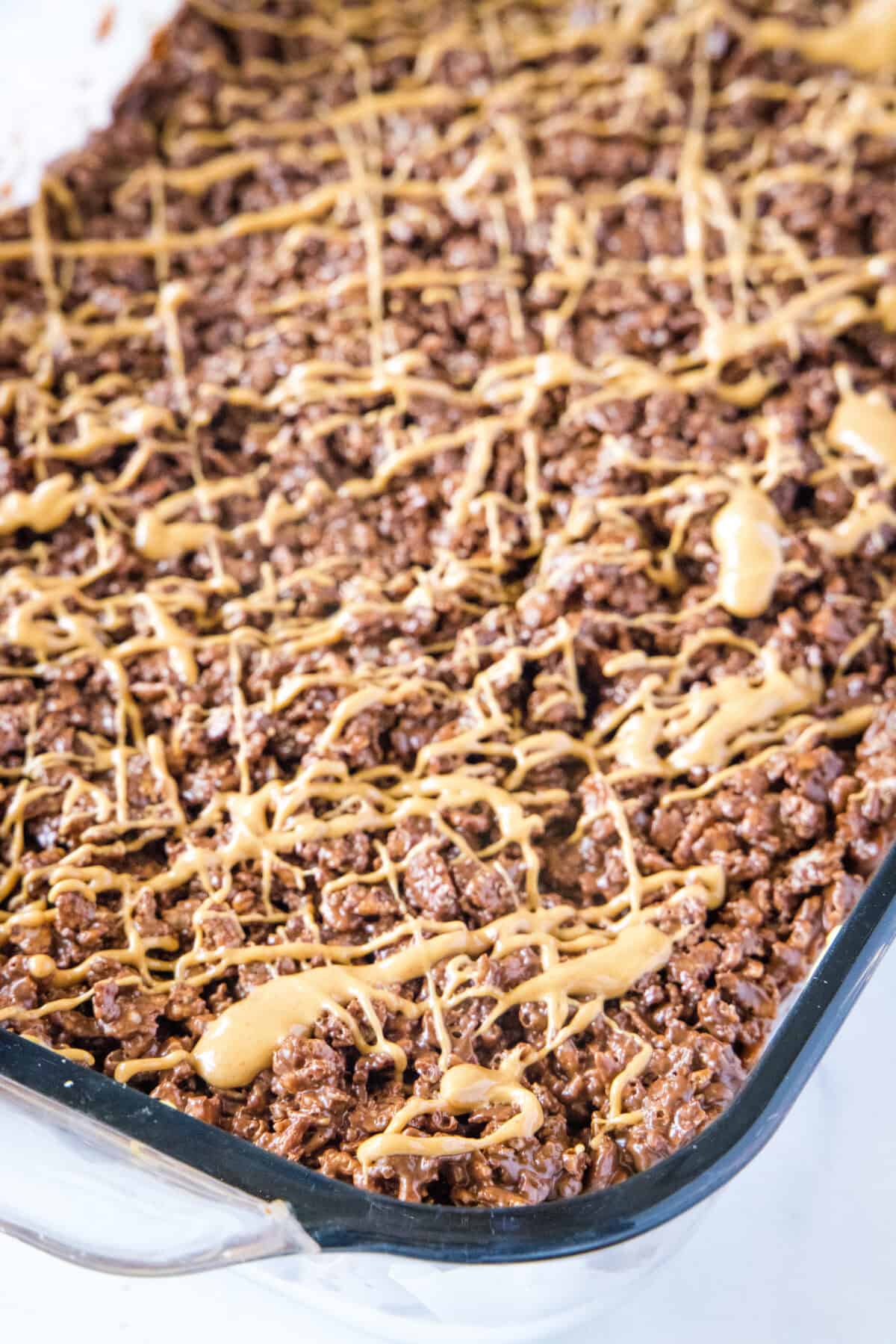 chocolate peanut butter krispie bars in baking pan