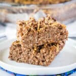 chocolate peanut butter krispie bars staked on a white plate