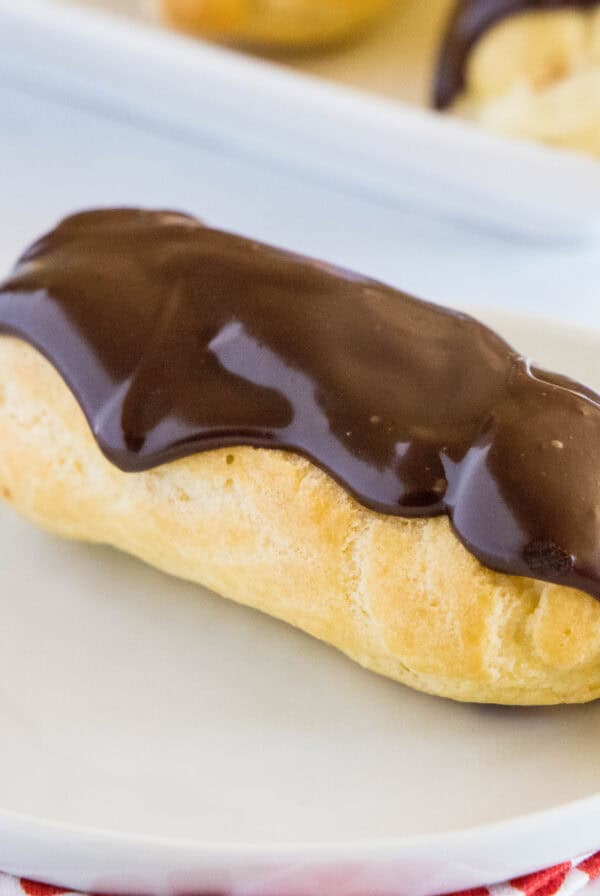 cropped close up eclair on a plate