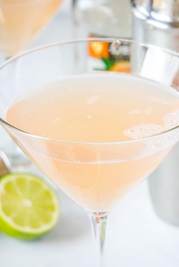 close up grapefruit martini in a glass