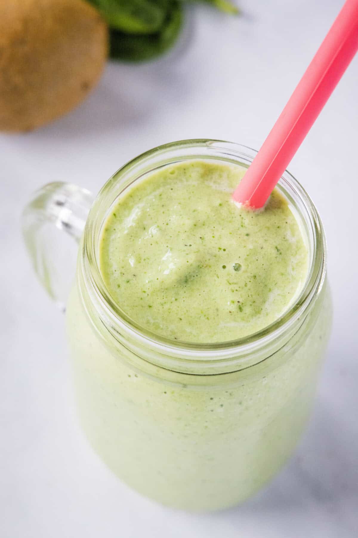 looking down on a cup with kiwi smoothie