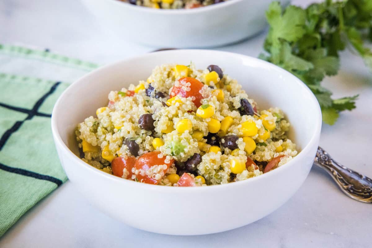 Mexican Quinoa Salad Mexican Quinoa Salad is a healthy, easy recipe with quinoa, black beans, corn, avocado, and a cilantro lime dressing. Perfect for meal prep, side dish, or bring to a potluck!