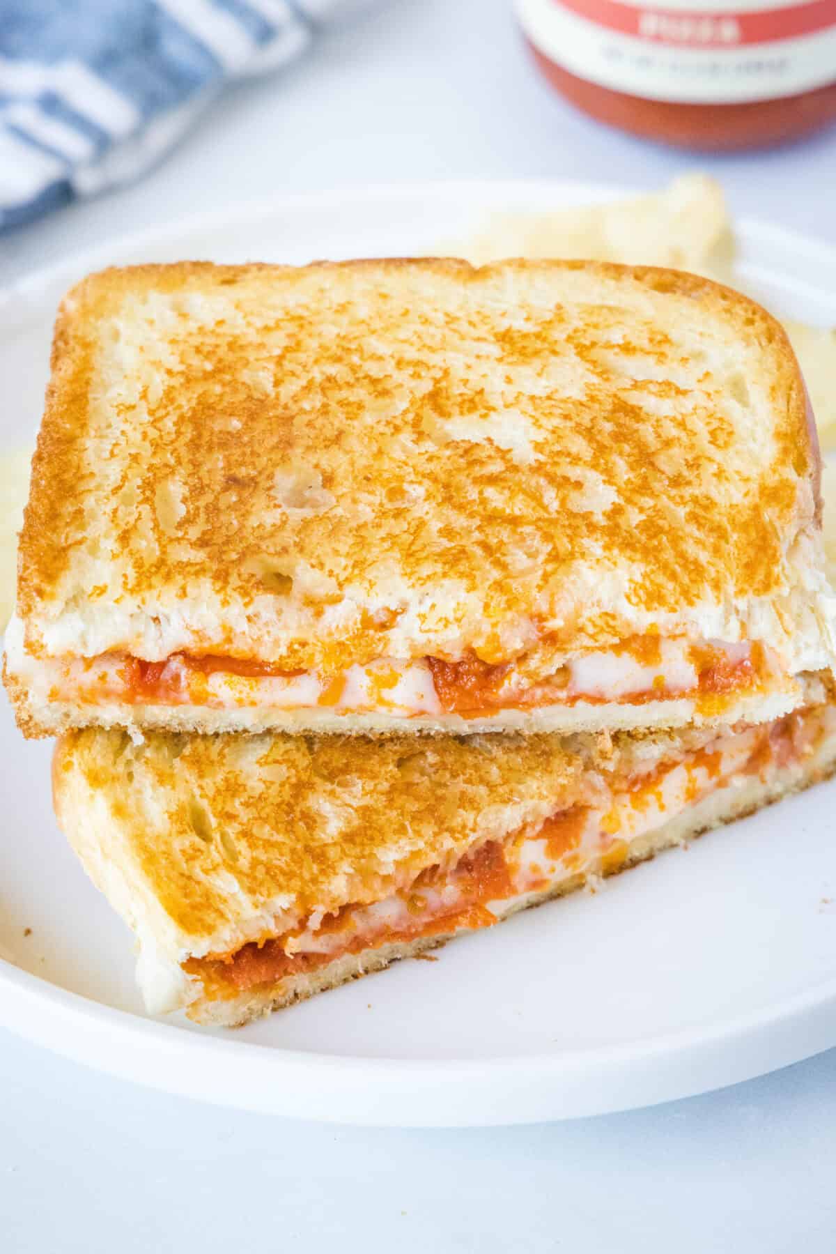 looking down on pizza rilled cheese cut in half on a plate