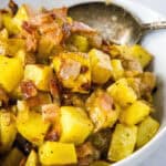 close up roasted potato salad in serving bowl