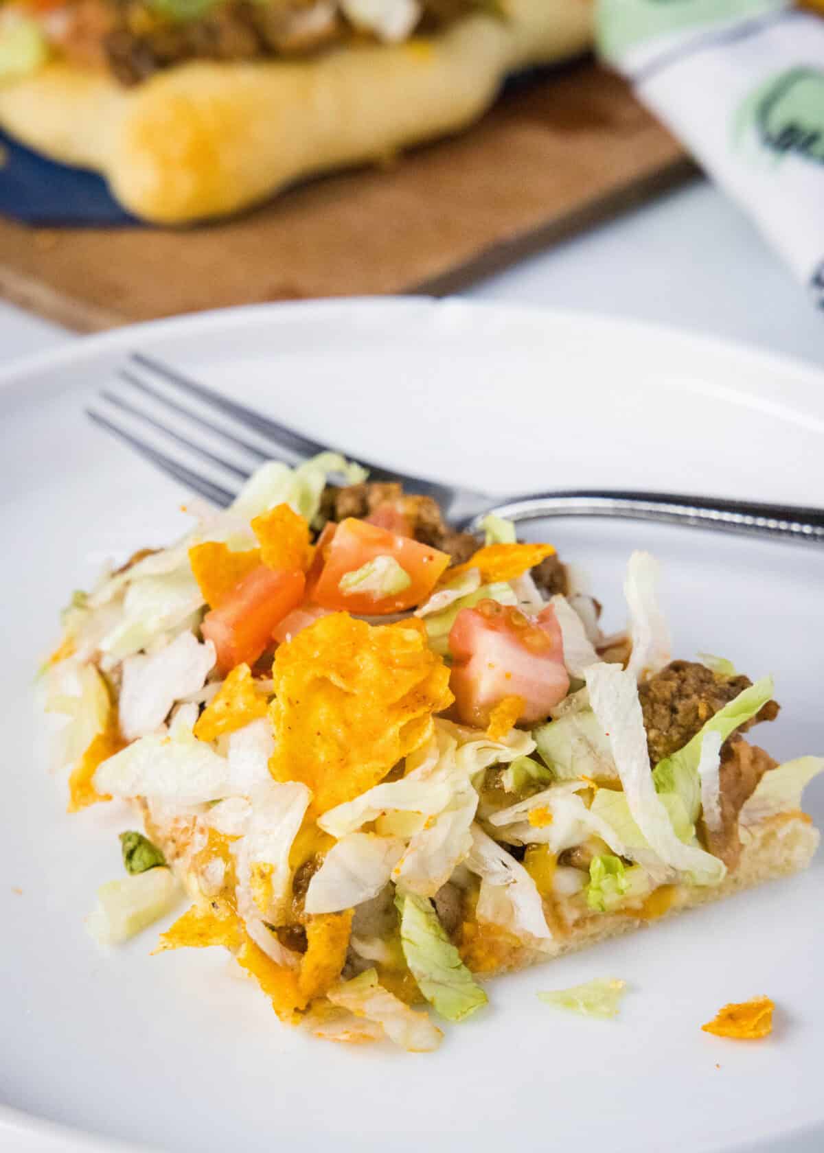 slice of taco pizza on a plate