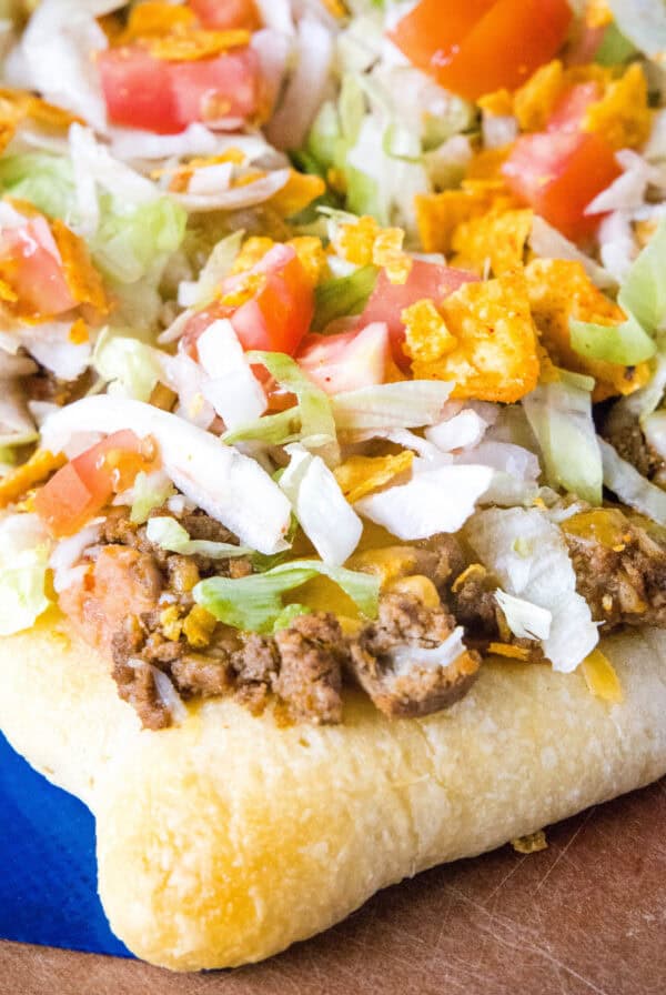 close up taco pizza on cutting board