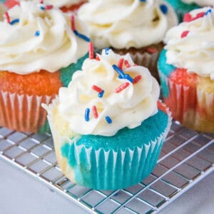 close up 4th july cupcakes on wire rack