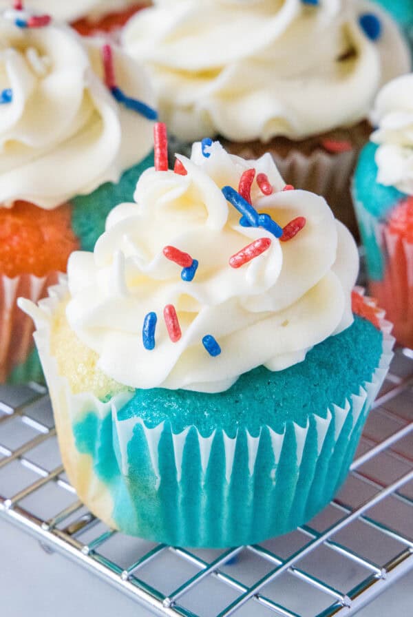 close up 4th july cupcakes on wire rack