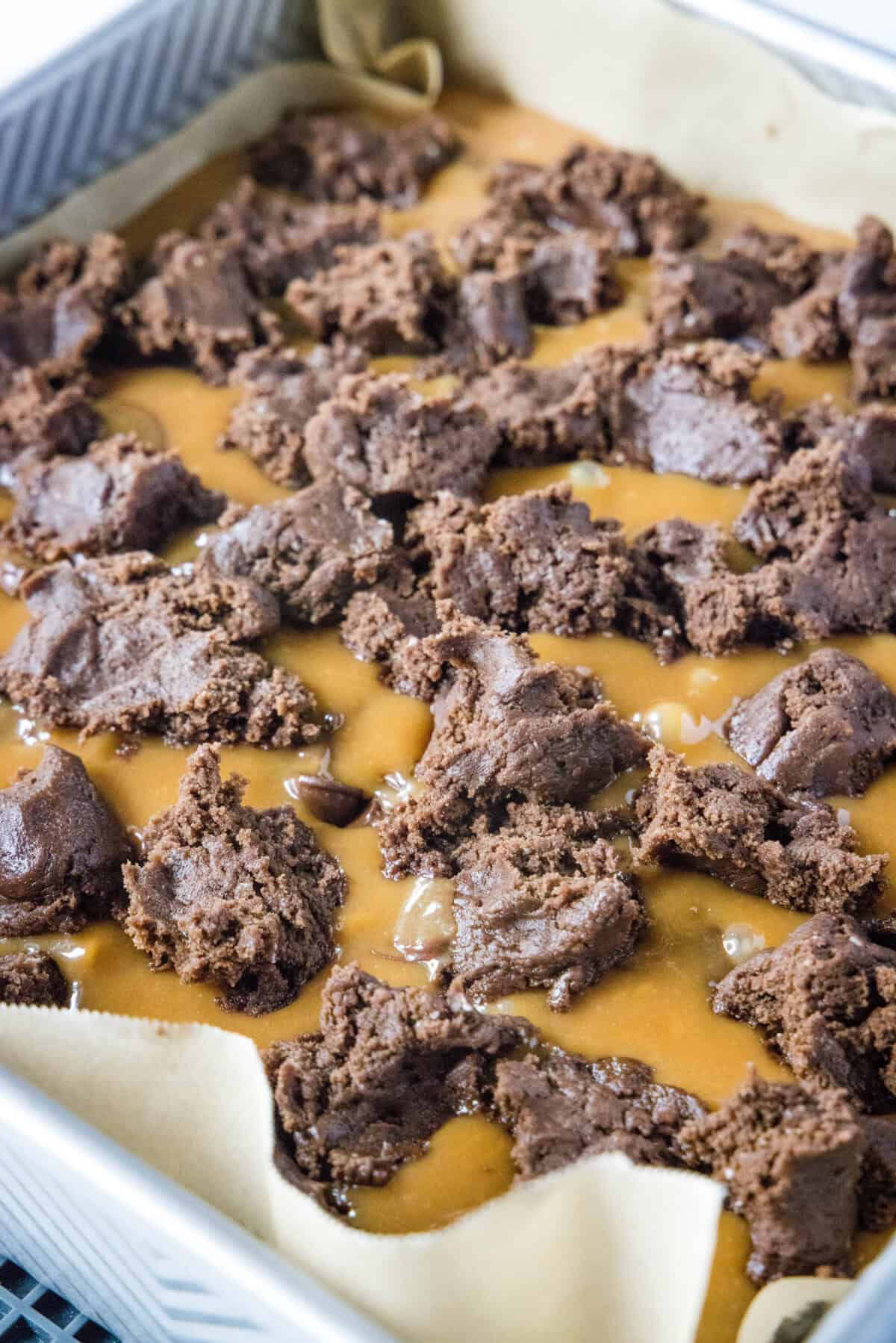 crumbling chocoltae layer over the top of the caramel