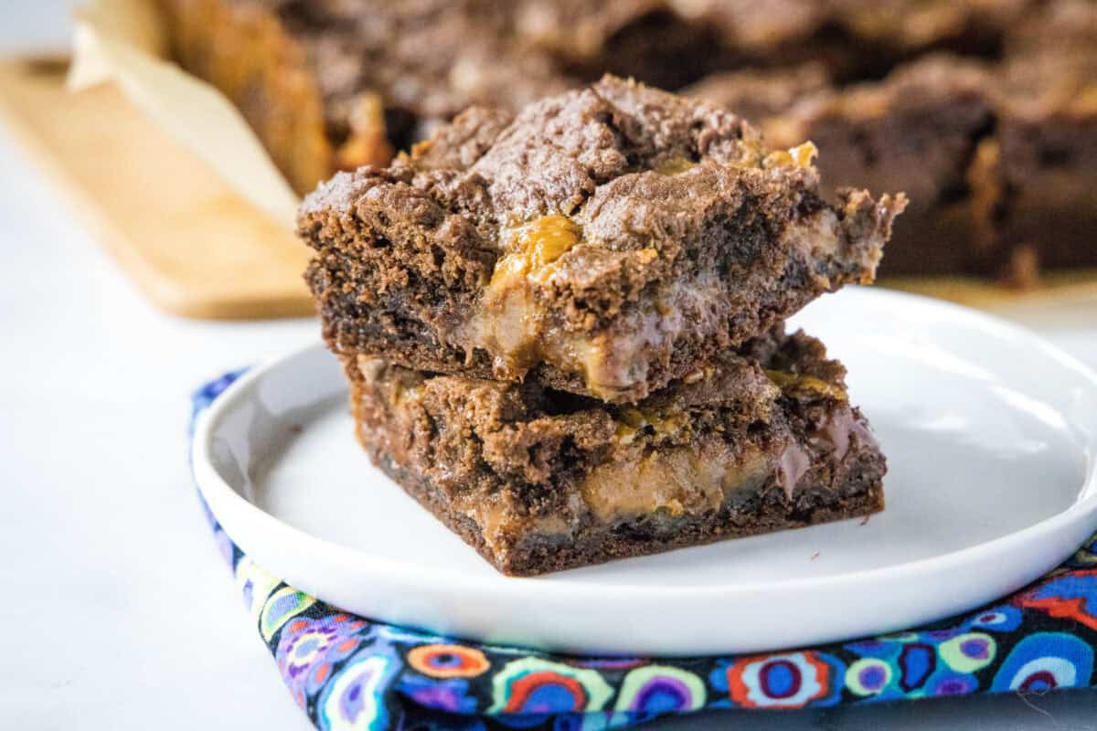Caramel Layer Bars are a Midwest classic made with German chocolate cake mix, gooey melted caramels, and chocolate chips. An easy, nostalgic bar cookie recipe Grandma always made.