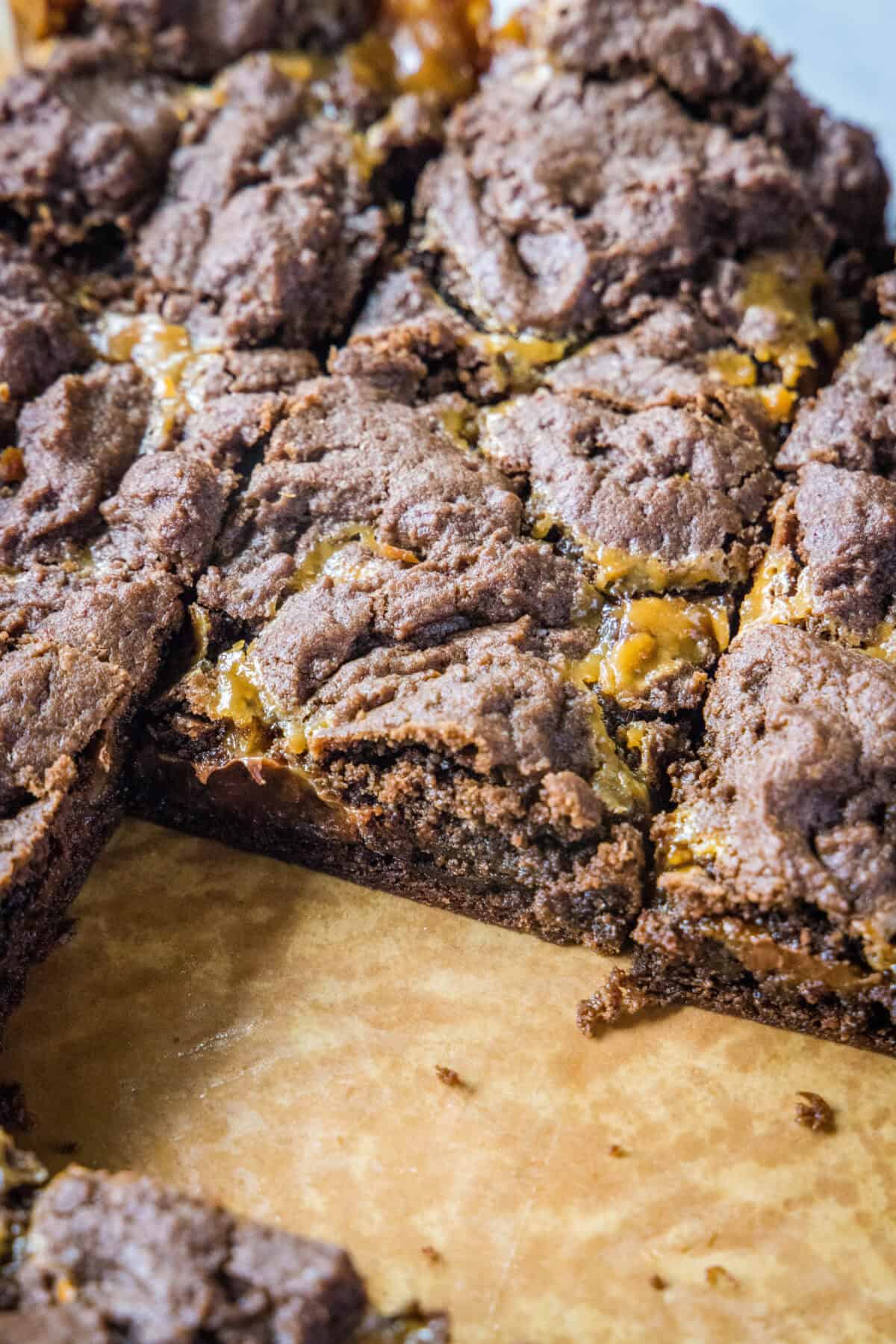 caramel layer bars on a cutting board