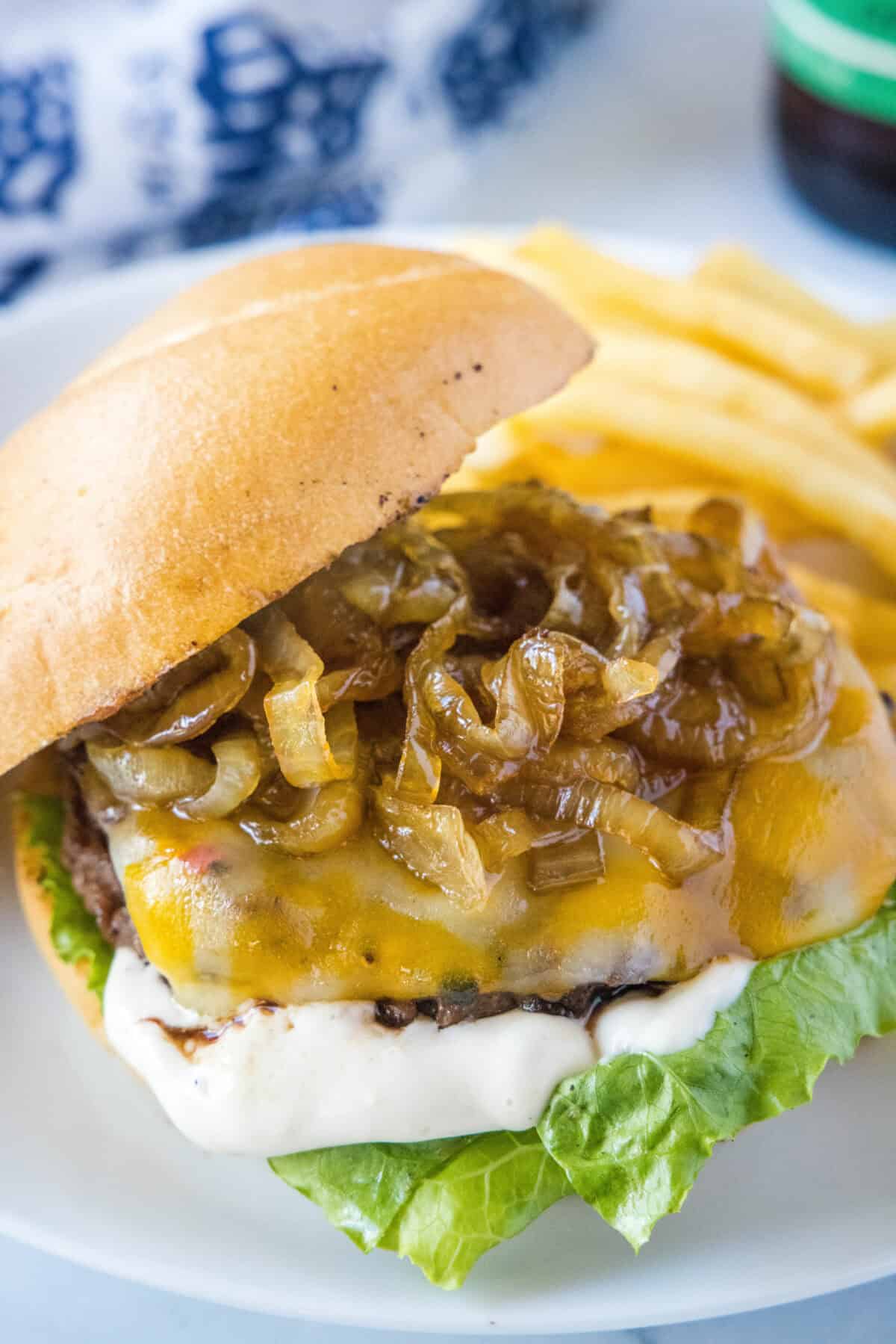 caramelized onion burger on a plate