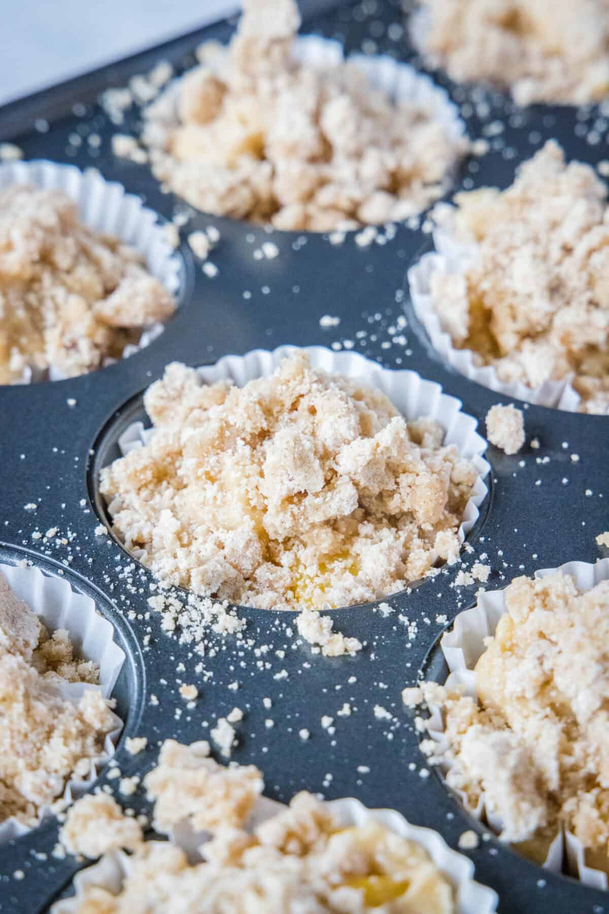 adding streusel topping to muffin batter