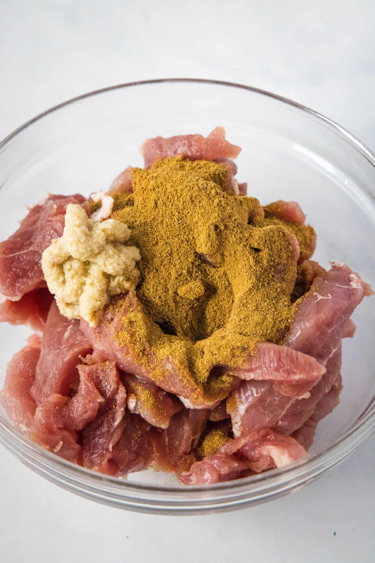ginger and five spice over pork tenderloin slices