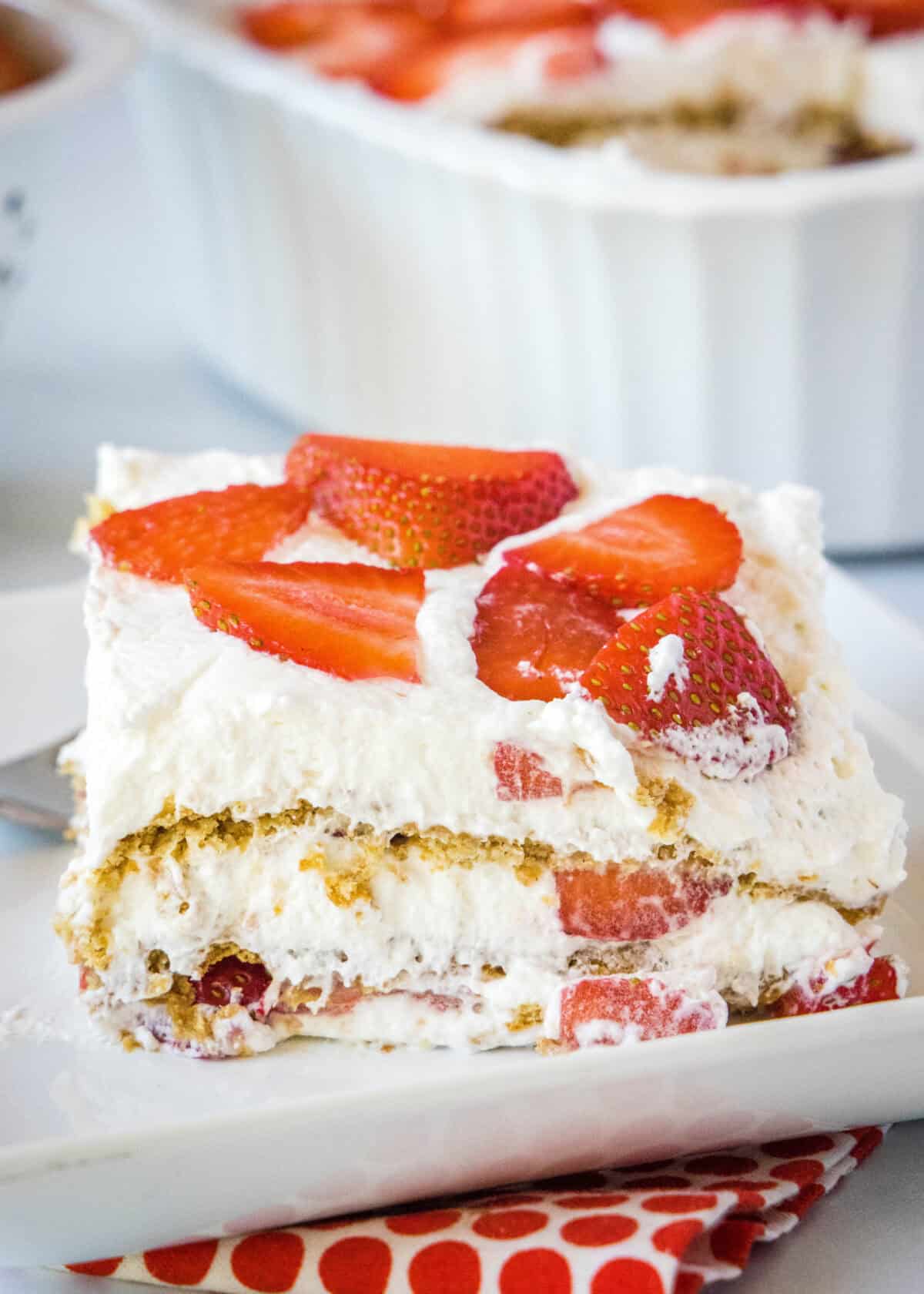 slice of strawberry ice box cake on a plate