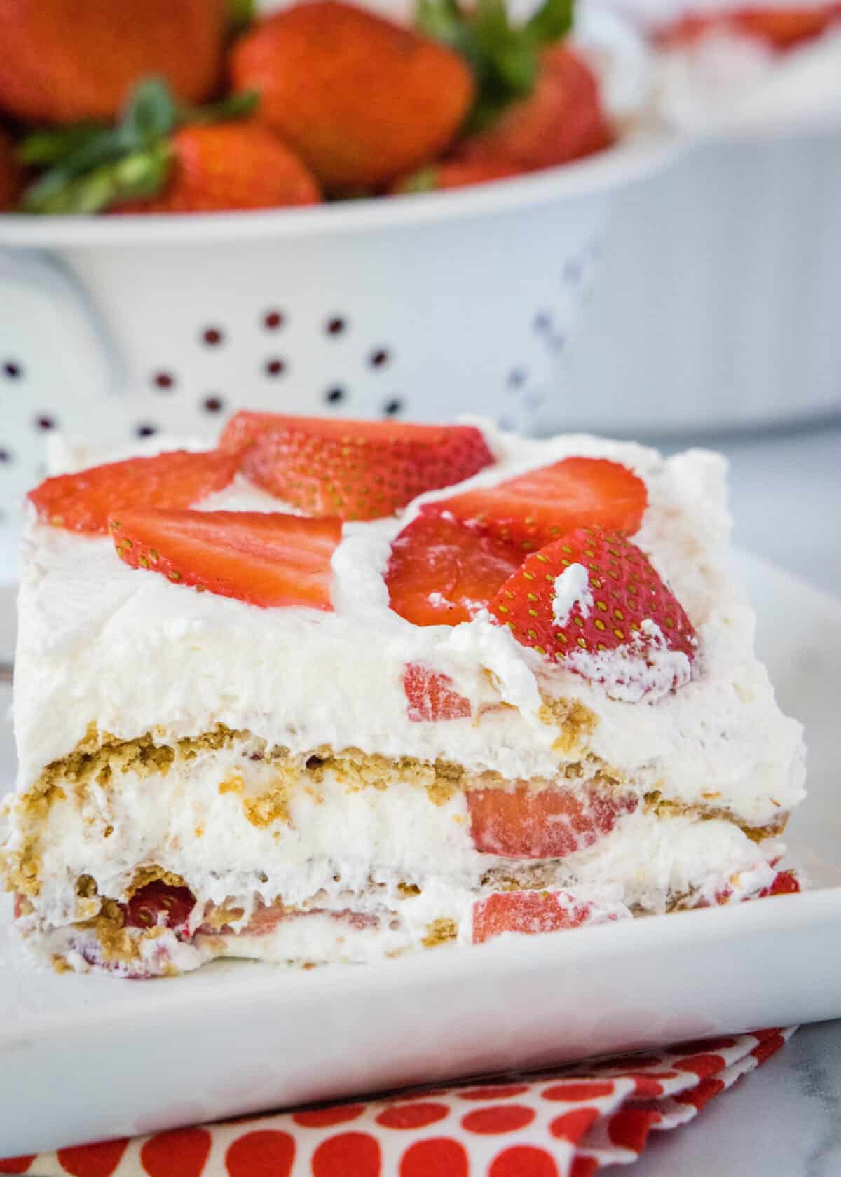 strawberry ice box cake slice on a plate