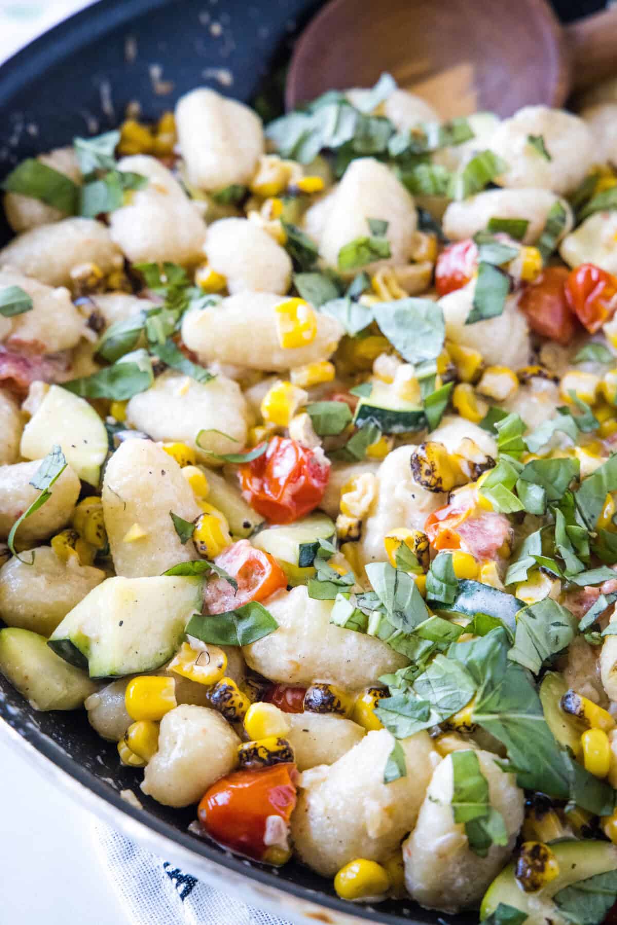large skillet with summer gnocchi