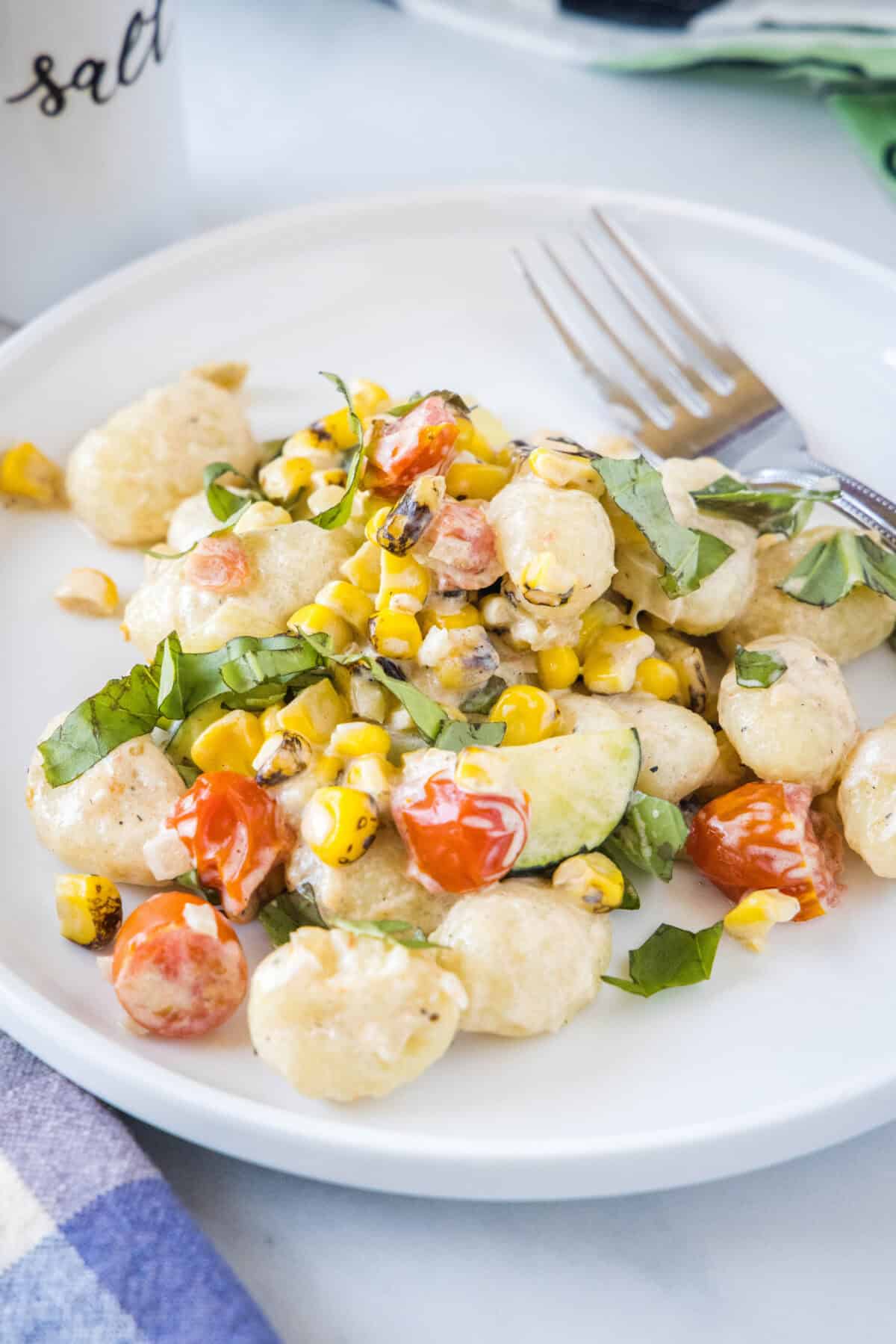 summer gnocchi on a plate with a fork