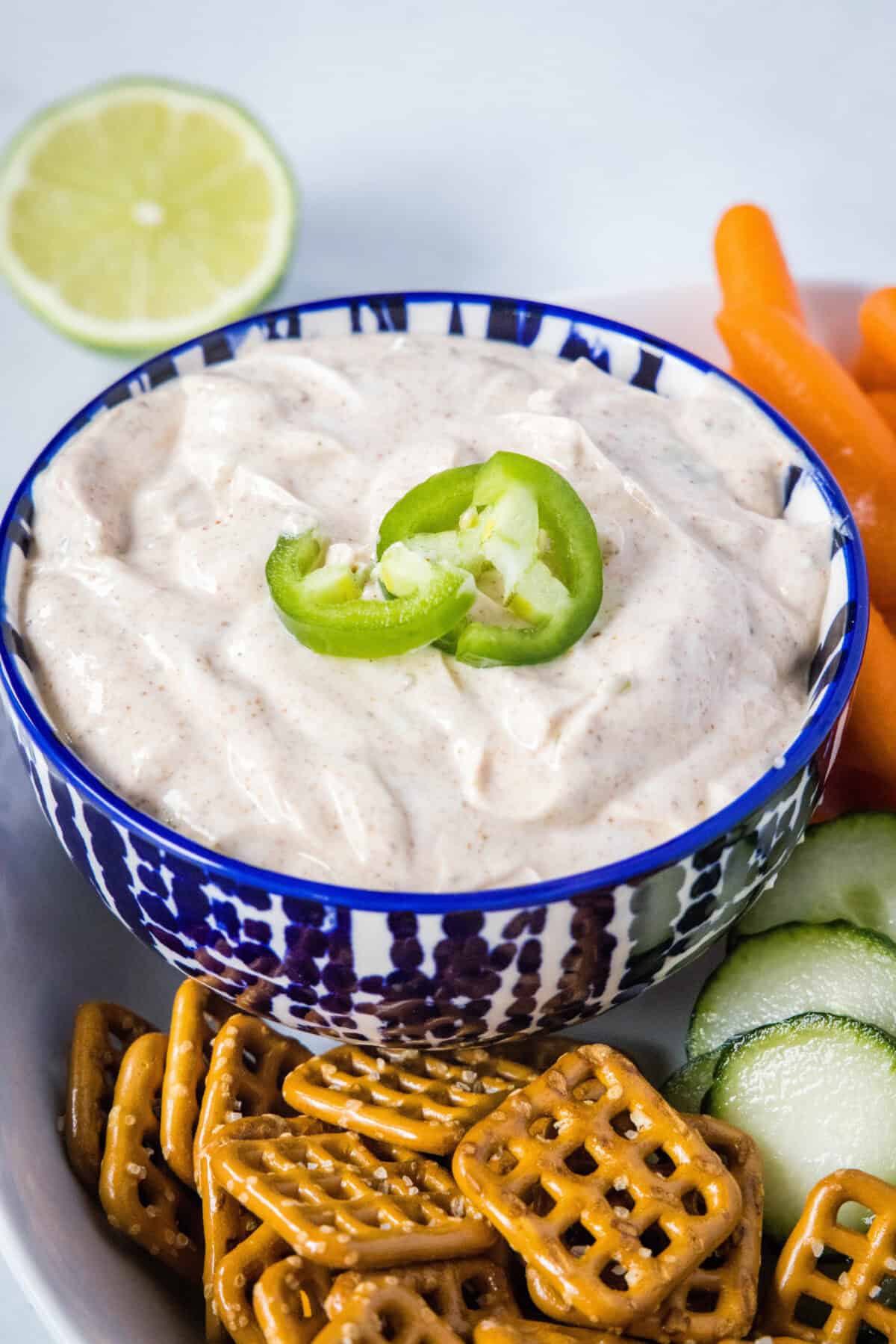 yogurt dip in a bowl with pretzels around it