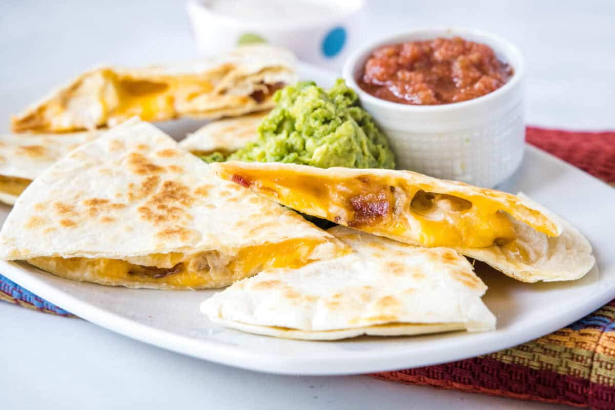 Bacon Ranch Chicken Quesadillas are loaded with melty cheese, crispy bacon, and a creamy ranch kick. Ready in 15 minutes and perfect for busy weeknights!