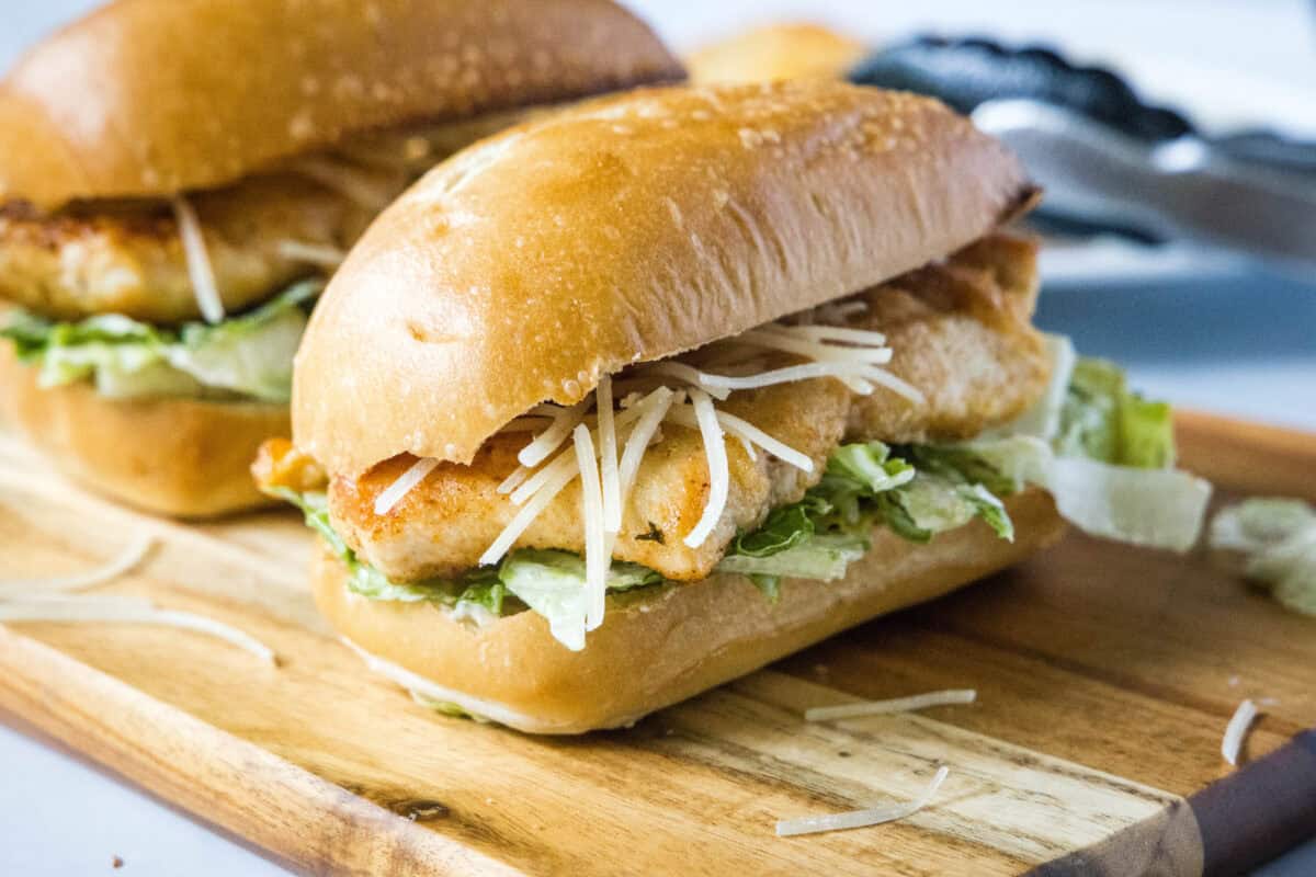 This chicken caesar sandwich features golden pan-fried chicken cutlets, crisp romaine, and creamy Caesar dressing on a toasted buttery sub roll. Ready in 30 minutes!