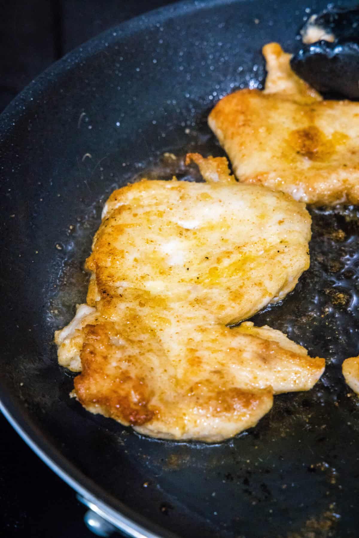chicken cutlets in skillet